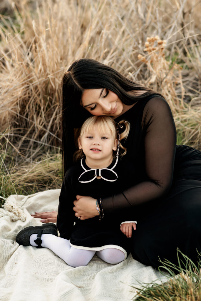 Family photo with mother and daughter embracing